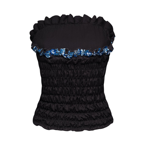 black corset with blue floral accents, with frills at top