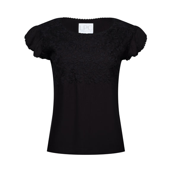 black frilled shirt with frilled sleeves with black floral accents