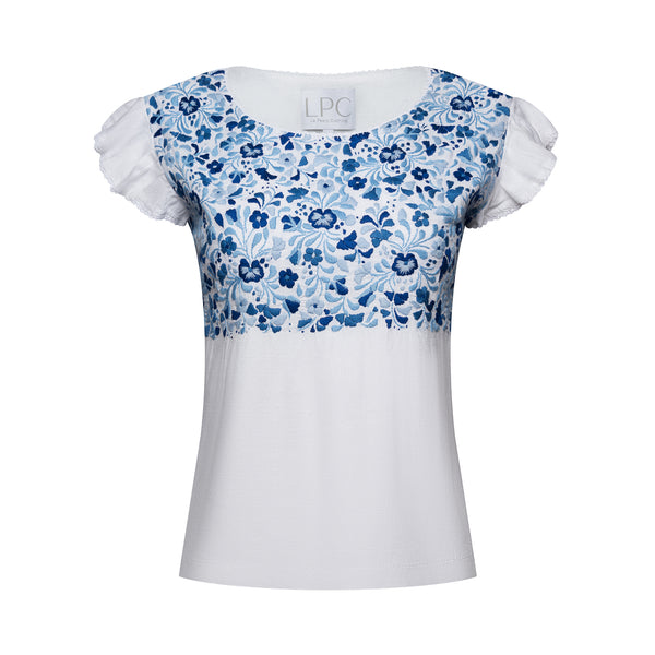 white frilled shirt with frilled sleeves with blue floral accents