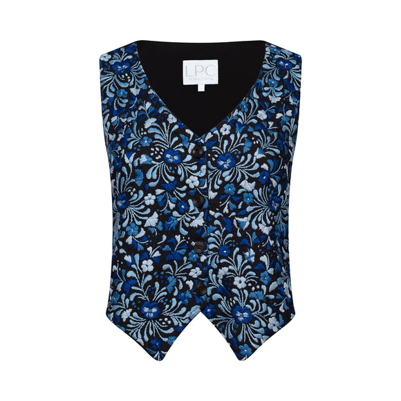 a black vest with a blue floral pattern