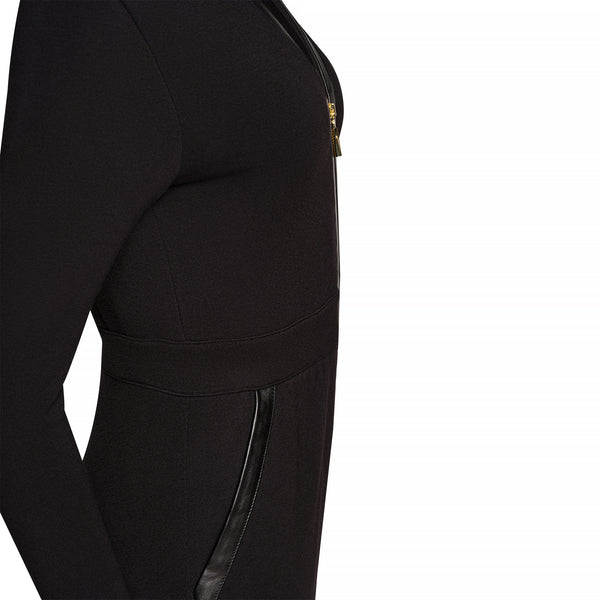 closeup of black colored jumpsuit with gold zipper, from side angle