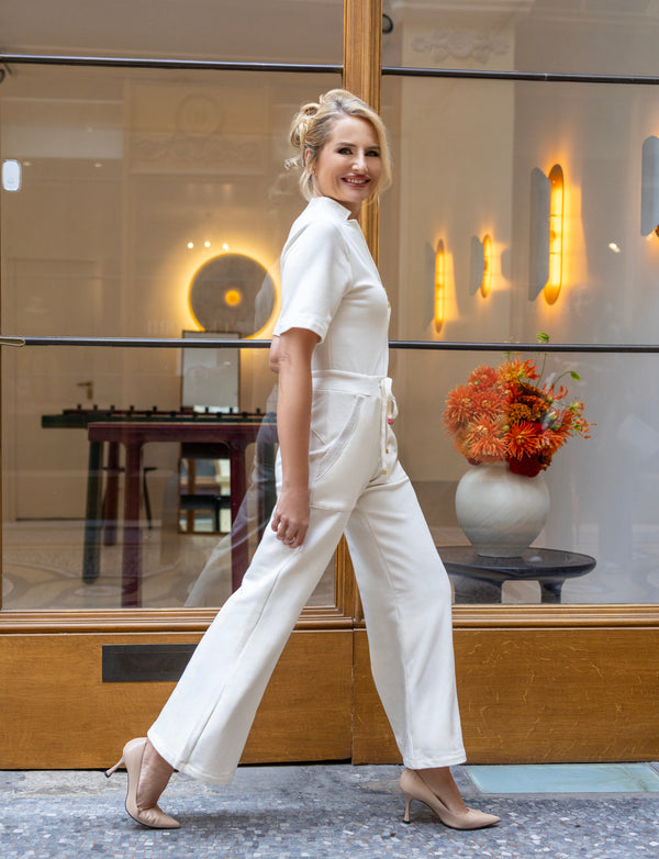 woman wearing white shirt and white pants