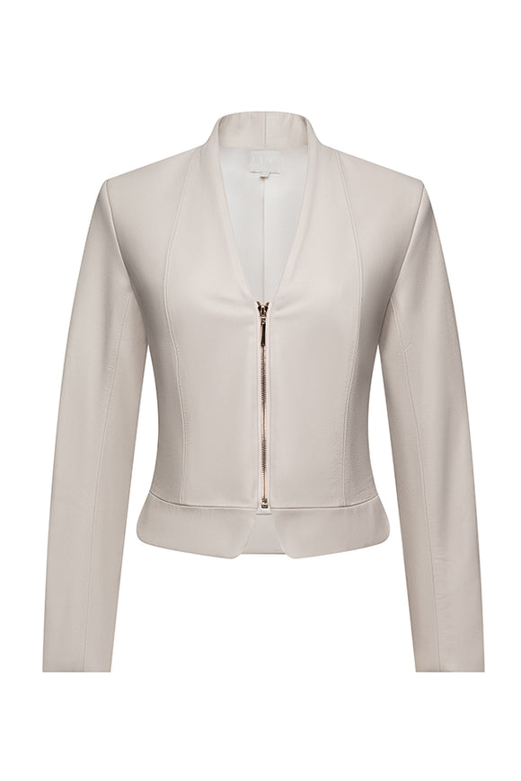 cream colored jacket with gold zipper