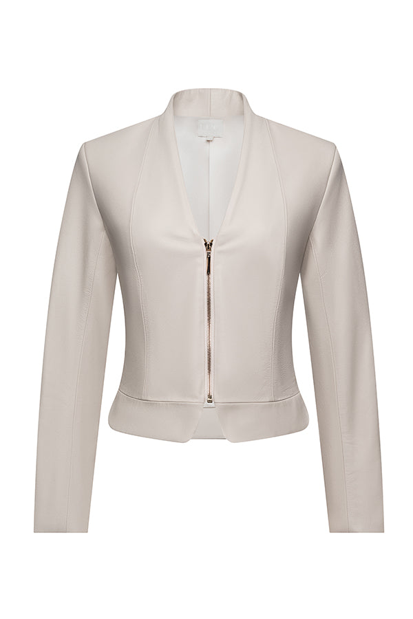cream colored jacket with gold zipper