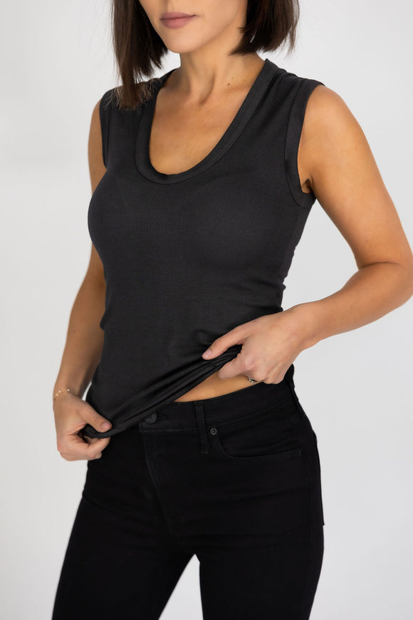 woman wearing a black tank top