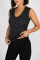 woman wearing a black tank top