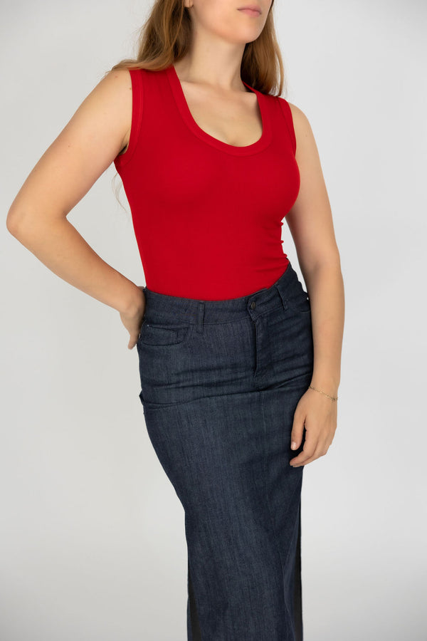 red tank top on a woman with black dress pants
