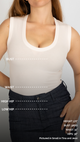 woman wearing white tank top with a diagram