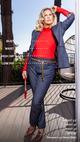 woman wearing red long sleeved shirt, and blue overcoat and pants, with gold chained belt, with measurements