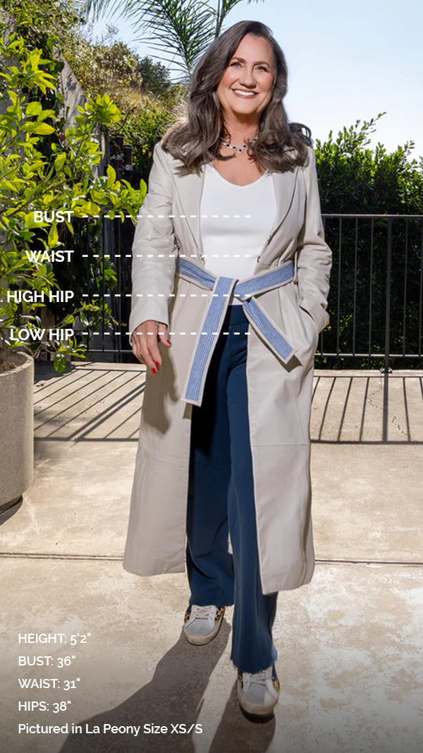 woman wearing a trench coat with measurements