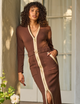 woman wearing brown dress with gold zipper and brown belt