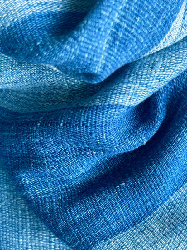 closeup of blue striped poncho dress