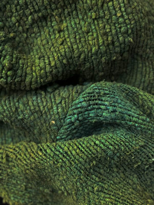 closeup of green poncho