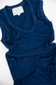 blue tank top laid out on the floor