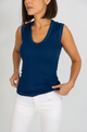 Woman wearing a blue tank top, front view