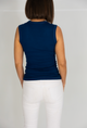 Woman wearing blue tank top, back view