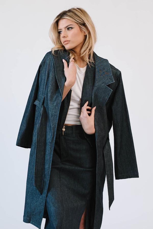 woman wearing white shirt with denim trenchcoat with long denim skirt