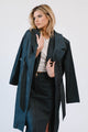 woman wearing white shirt with denim trenchcoat with long denim skirt