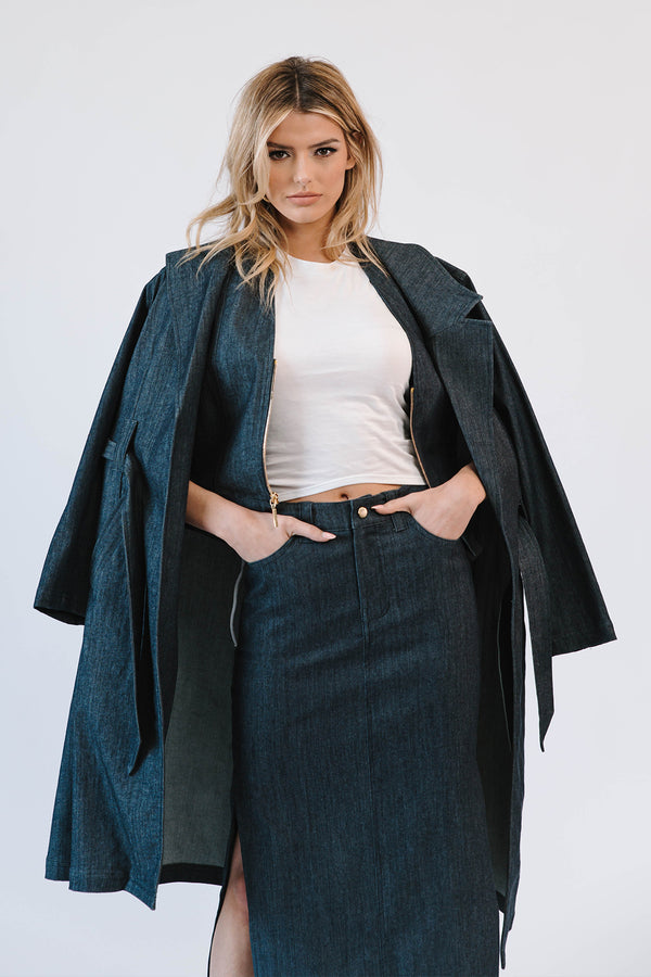 woman wearing white shirt with denim trenchcoat with long denim skirt