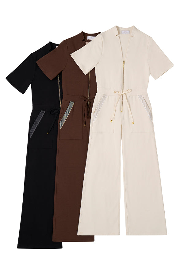 collection of tan, brown and black jumpsuits with gold zippers