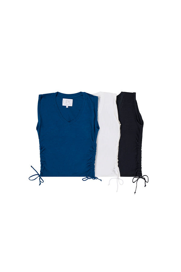 collection of blue, white, and navy blue v neck shirts