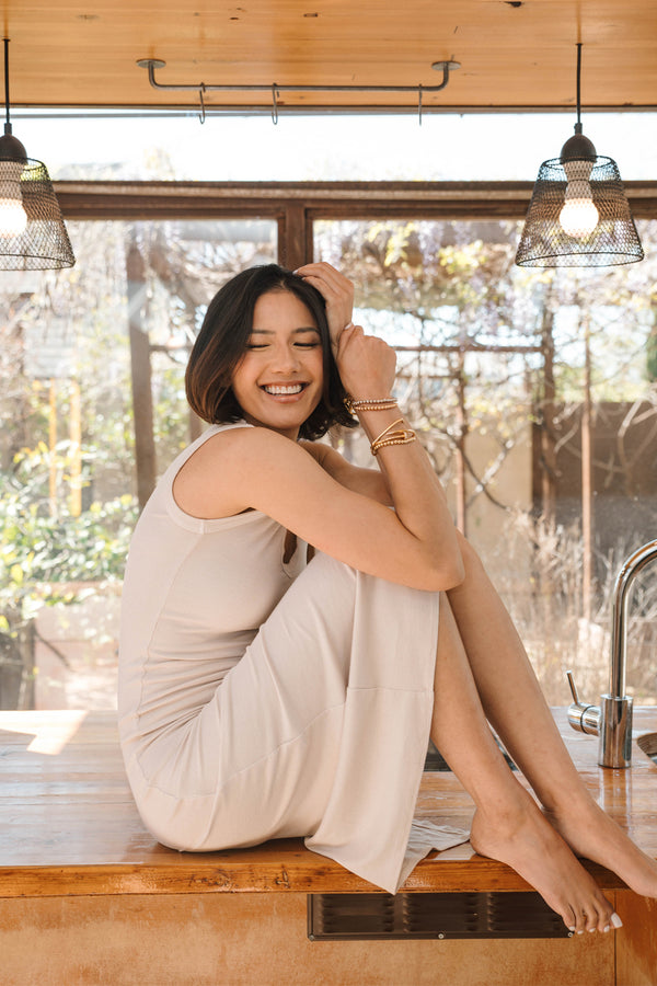 woman wearing long tan dress