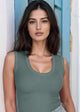 woman wearing balsam green tank top