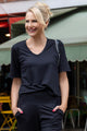 woman wearing black shirt and pants