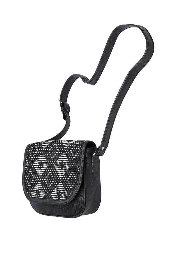 black handbag with black and white patterned