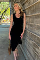 woman wearing long black dress with sunglasses