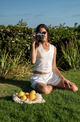 woman wearing white tank top and white shorts