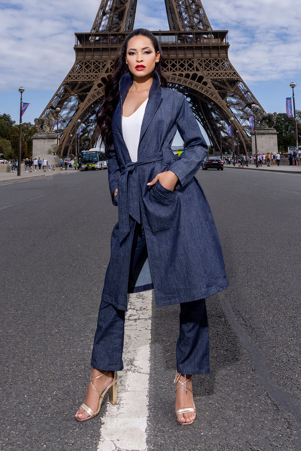 woman wearing white shirt, with long navy blue denim trenchcoat