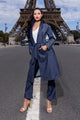 woman wearing white shirt, with long navy blue denim trenchcoat