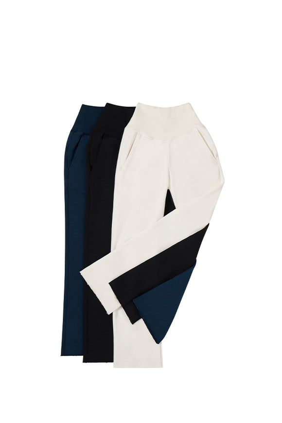 collection of long white, black, and navy blue pants